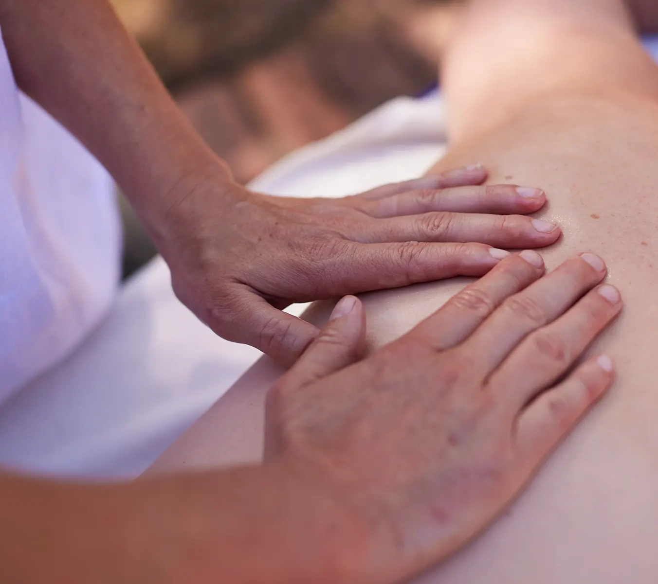 Mobile massage performed on raised table, outdoors, near hobart